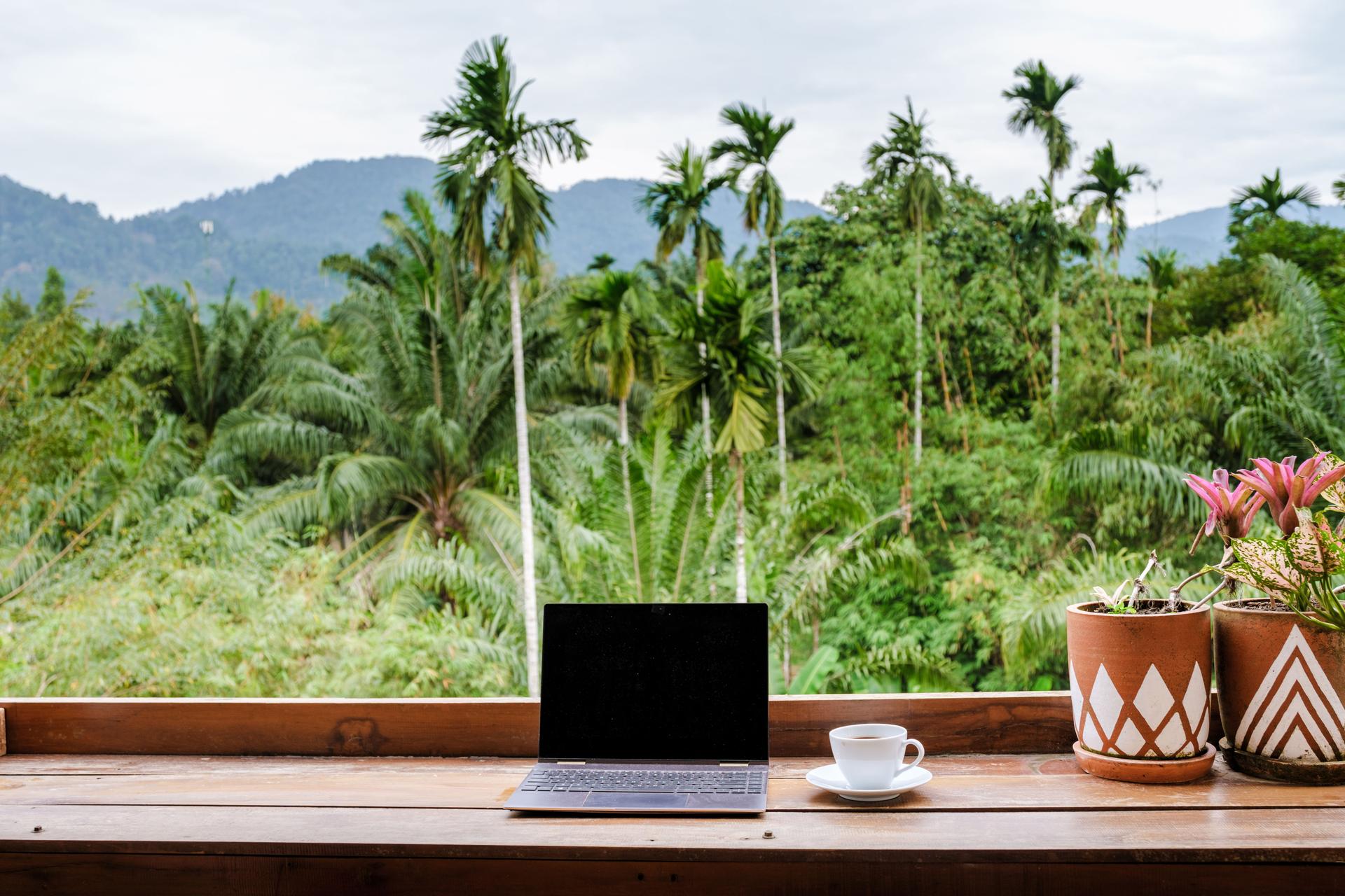 Relaxing workspace overlooking lush landscapes in tropical Thailand and Bali region